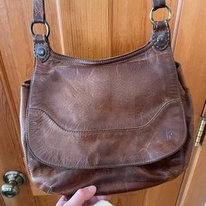 Frye leather cross body purse with outer pocket and inner pockets